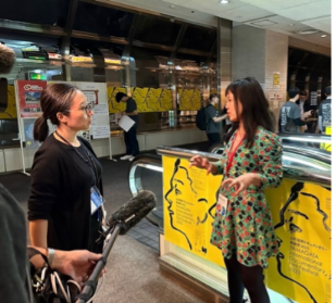 ortrait of author being interviewed by Japan Broadcasting Corporation as juror of Yamagata International Documentary Film Festival 2023 in Japan, by Kah Wai Lim.