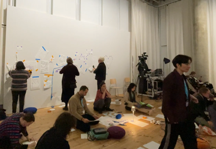 people &lsquo;doing neurodiversity&rsquo; in different ways, including by displaying their creations on a wall that acts as a shared canvas;