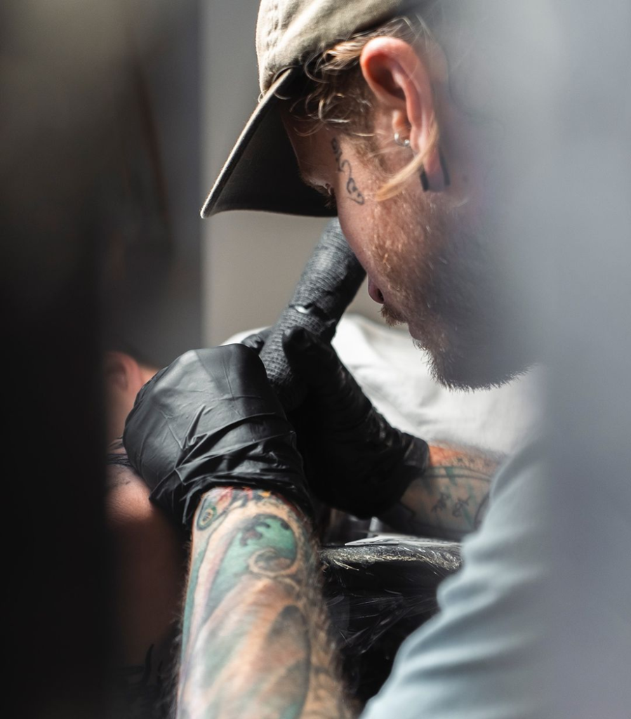 'Adam McDade tattooing a client at Flesh Tattoo, Manchester (2024)'